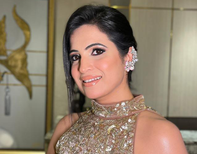 HD dewy party makeup by Nithika Aroraa featuring glowing skin, elegant eye makeup, and a luxurious finish.